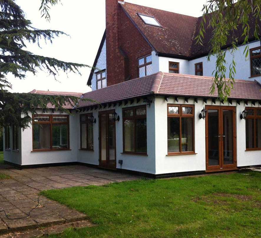 brown framed conservatory with white walls
