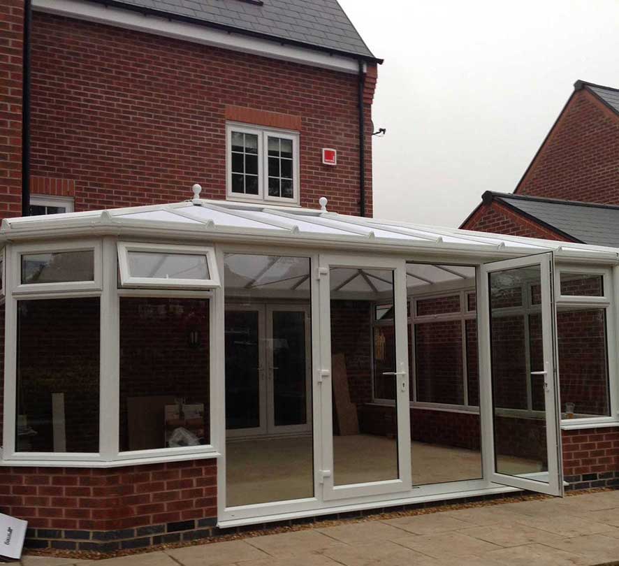 white conservatory with dark bricks